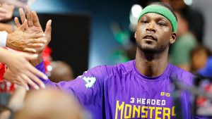 Kwame Brown giving fans high fives before a BIG3 game.