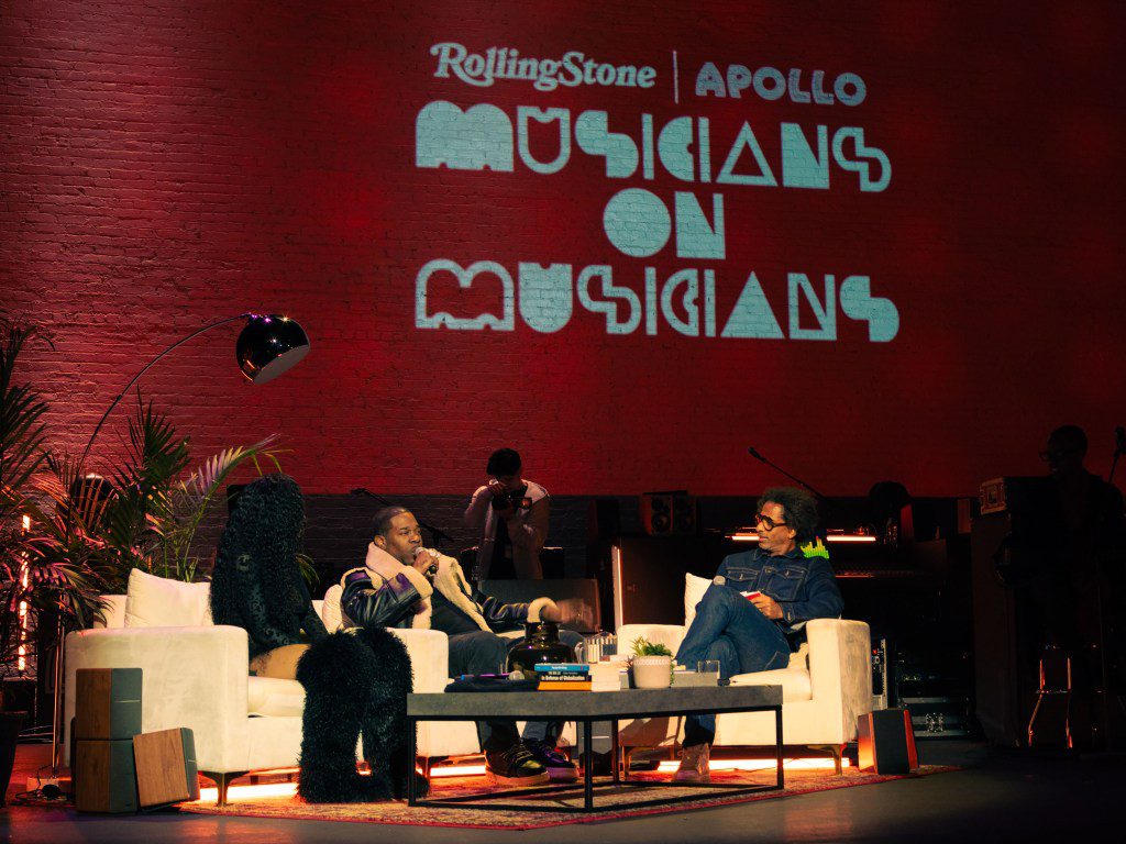 GloRilla, Busta Rhymes, and Toure talking on stage at the Apollo Theater