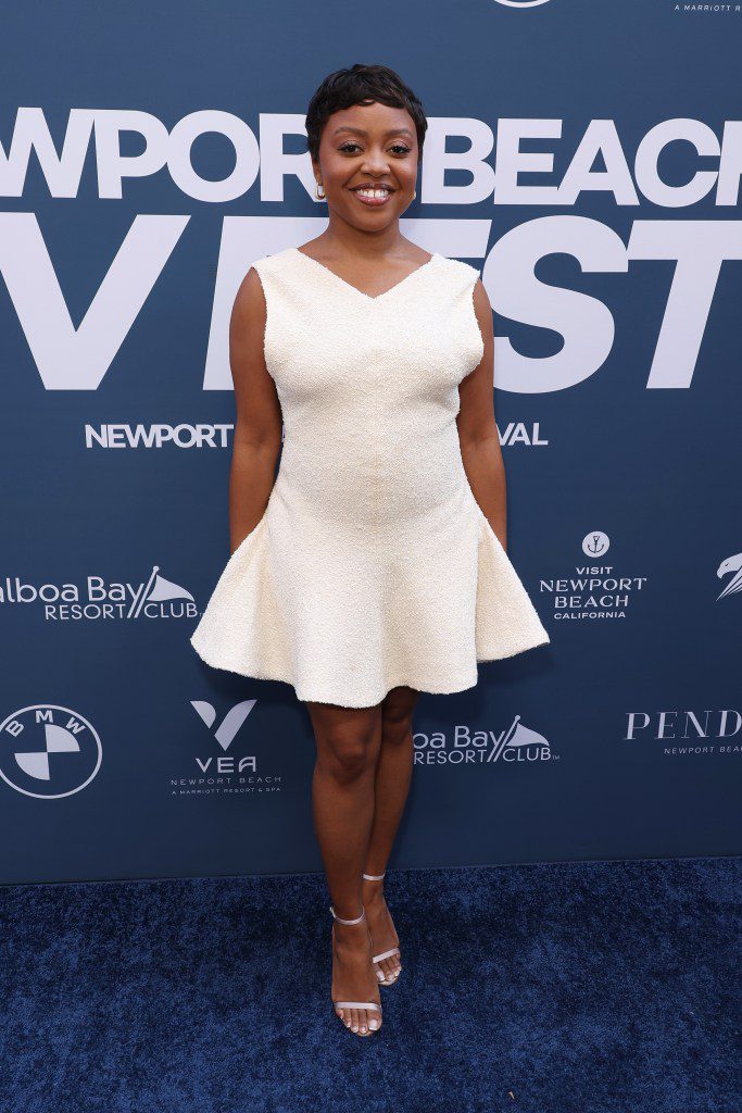 Quinta Brunson wearing white dress