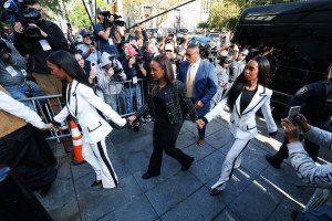 Chance Combs (C) walks with twin sisters Jessie James Combs and and D'Lila Star Combs